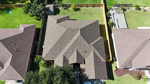 Aerial view of completed roofing project in McAllen residential area