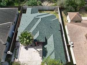 Residential roofing project with green energy-efficient shingles in Mission, Texas.