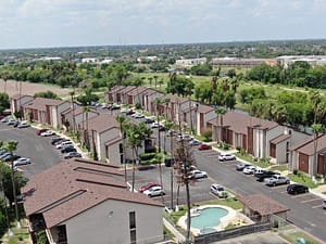Aerial photo of residential roof installations and repairs by XYZ Roofing in McAllen, TX neighborhood